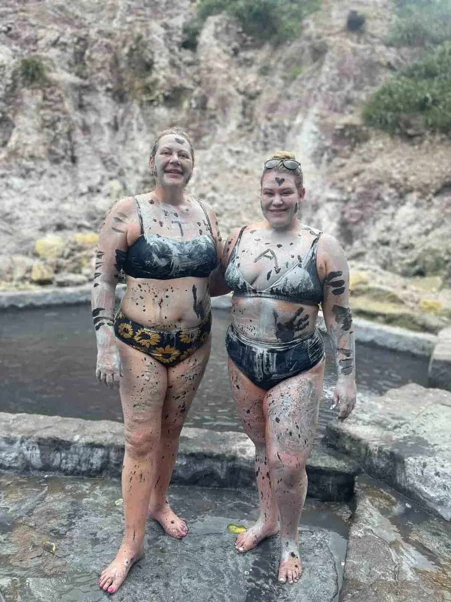 Guests at a St. Lucia mud bath with Let’s Go Land & Sea Tours